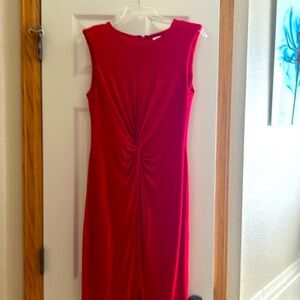 Brand new. Never worn. Removed tags and shoulder pads. Small slit in front.